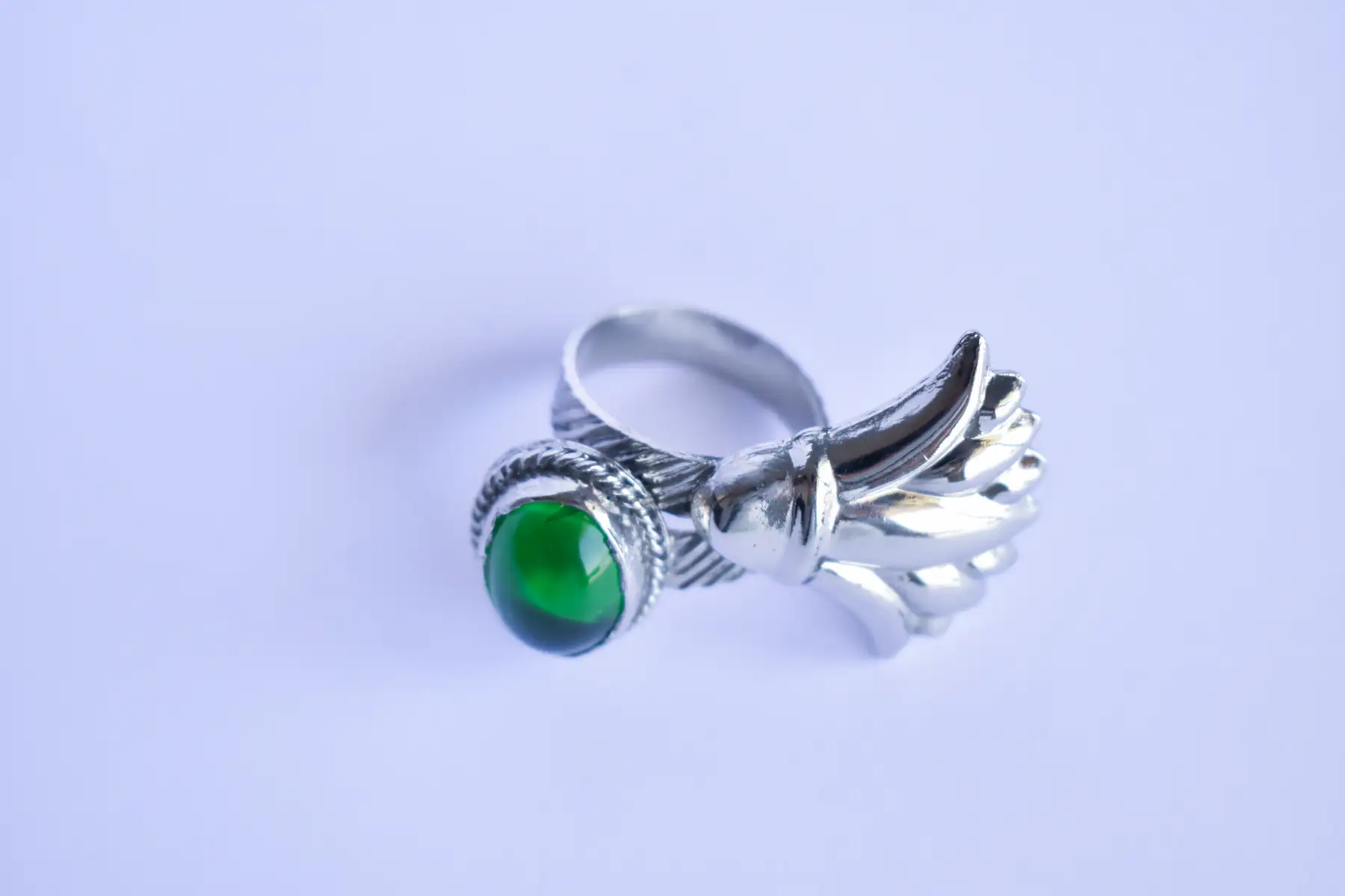 silver plated copper ring with green resin and lotus flower design